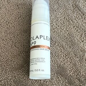 OLAPLEX No.9 Bond Protector Serum with White and Peach Accents
